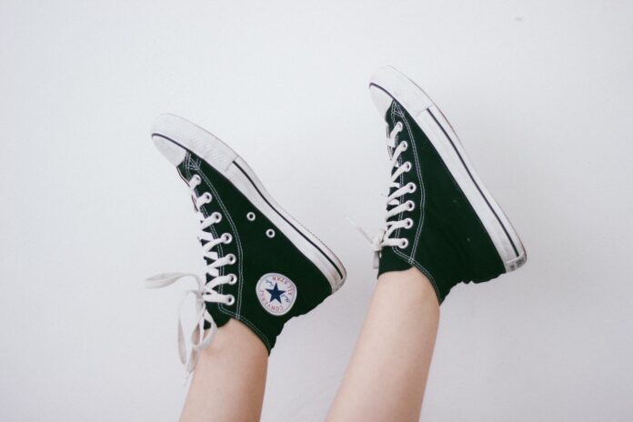 black and black and white Converse All Star high-top sneakers
