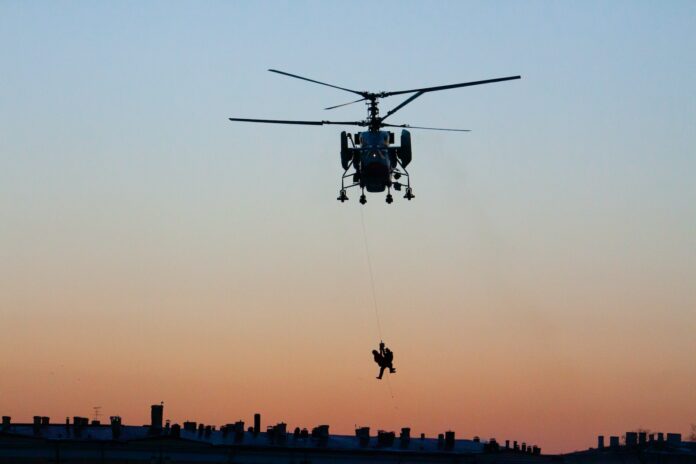 silhouette photography of helicopter
