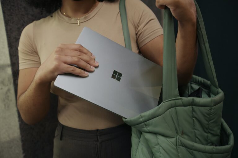 Female putting her Surface laptop in her bag